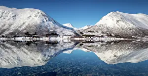 Snow Covered Prints: Snow-covered mountains with a perrfect reflection in flat calm waters of a fjord