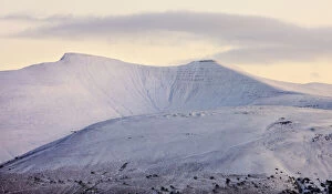 Snow covered Pen y Fan and Corn Du mountains in the Brecon Beacons National Park, Powys, Wales, UK
