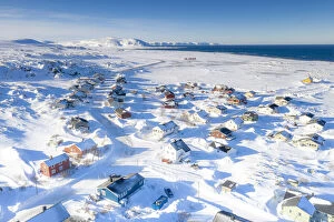 Images Dated 24th November 2020: Snow covering the fishing village of Berlevag by the arctic sea, aerial view