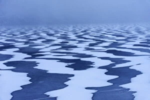 Images Dated 13th July 2020: Snow textures shaped by the wind on a frozen lake in the Lofoten islands, Norway