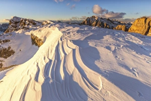 Snow waves between rocks, Mount Lagazuoi, Cortina d'Ampezzo, Belluno district, Veneto Snow waves between rocks, Mount Lagazuoi, Cortina d'Ampezzo, Belluno district, Veneto