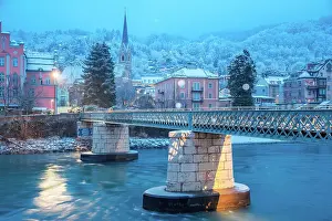 Inntal Prints: A snowy morning by the bridge of Emile Bethouart with the church of Sankt Nikolaus in the background