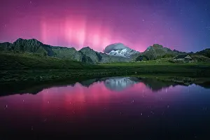 Aurora Borealis Prints: Snowy peak of Monte Disgrazia reflected in a lake during the Northern Lights