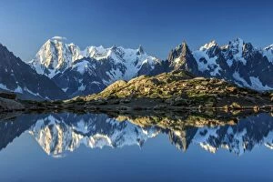 Snowy peaks of Dent Du Geant and Grandes Jorasses are reflected in Lac Blanc, Haute Savoie