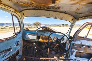 Namib Desert Gallery: Solitaire, Namibia, Africa. Abandoned rusty car in the desert