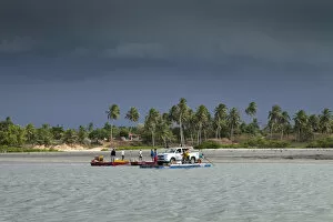 Images Dated 6th September 2012: South America, Brazil, Ceara, Camocim, storm clouds over the ferry rafts at Guriu