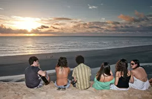 Images Dated 6th September 2012: South America, Brazil, Ceara, Jericoacoara, a guitarist and a group of girls watch