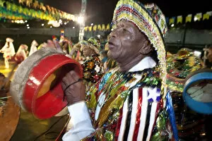 Images Dated 10th September 2012: South America, Brazil, Maranhao, Sao Luis, a costumed dancer with tamborim drum instrument
