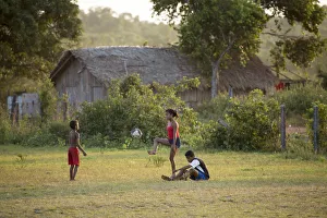 Amazonian Prints: South America, Brazil, Para state, Marajo island, Soure, children playing football