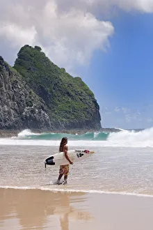 South America, Brazil, Pernambuco, Fernando de Noronha Island, surfer on Father s