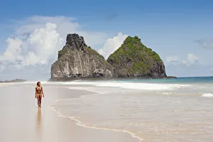 South America, Brazil, Pernambuco, Fernando de Noronha Island, a girl walking along