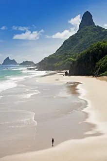 Girl Prints: South America, Brazil, Pernambuco, Fernando de Noronha Island, a young woman walking