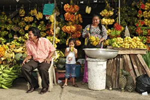 South America, Colombia, Leticia, Amazon region, Family selling fruit at a market