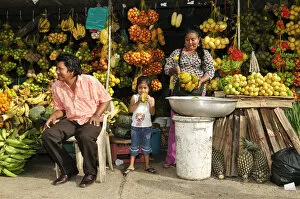 Images Dated 27th June 2012: South America, Colombia, Leticia, Amazon region, Family selling fruit at a market