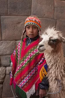Incan Gallery: South America, Peru, Cusco. A Quechua boy in a poncho and a chullo woollen cap with
