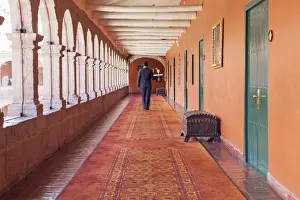 Peru Prints: South America, Peru, Cusco, a waiter carrying a tray with a cocktail to a room in