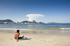 South America, Rio de Janeiro, Rio de Janeiro city, a sunbather at the end of Copacabana