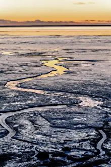 Hringvegur Prints: Southern Iceland: sunset reflecting in the ice on the road to Stokksnes, Vestrahorn, Hofn