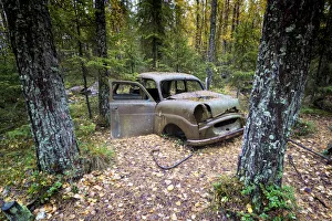 Southern Sweden, Northern Europe. Abandoned cars at Kyrko Mosse junkyard Southern Sweden, Northern Europe. Abandoned cars at Kyrko Mosse junkyard