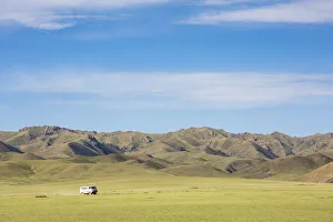 Minibus Prints: Soviet minivan and mountains in the background. Bayandalai district, South Gobi province