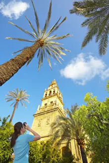 National Landmark Gallery: Spain, Andalucia, Cordoba, woman photographing La Mezquita cathedral, Low view (MR)