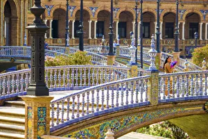 Spain, Andalucia, Seville Province, Seville, woman with colorful fan watching the horizon