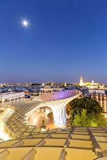Built Structure Collection: Spain, Andalusia, Seville. Metropol Parasol structure and city at dusk