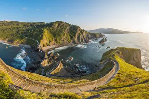 Spain, Basque Country, Gaztelugatxe. Walkway to the hermitage at sunset