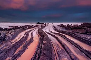 Steps Prints: Spain, Basque country, rock beach near Bilbao at sunrise