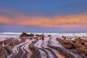 Spain, Basque country, rock beach near Bilbao at sunrise