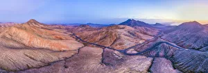 Cardon Mountain Prints: Spain, Canary Islands, Fuerteventura, mountain road crossing the volcanic landscape near