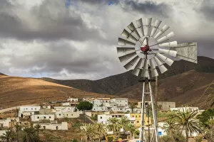 Spain, Canary Islands, Fuerteventura Island, Toto, desert village view with windmill