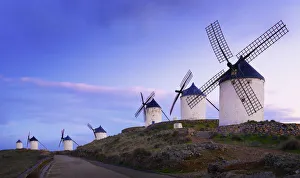 Spain, Castile, La Mancha, Consuegra, Windmills at dusk
