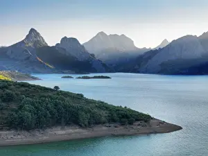 Spain, Castile and Leon, Embalse de Riano (Dam) beneath Picos de Europa at dawn