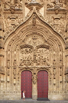Model Released Gallery: Spain, Castile and Leon, Salamanca, Woman at facade of cathedral, UNESCO World Heritage