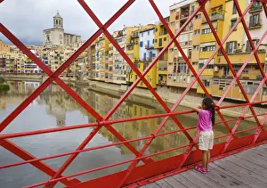 Spain, Catalonia, Girona, Girl on Eiffel bridge by Gustave Eiffel in 1887 (MR)
