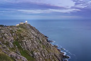 Spain, Galicia, Finisterre, Finisterre lighthouse at dusk