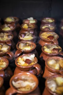 Images Dated 31st May 2022: Spain, Madrid, Taberna La Bola restaurant, Typical terracotta pots filled with the meat of