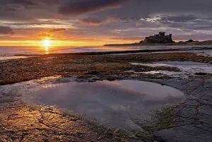 Northumberland Prints: Spectacular sunrise over the North Sea near Bamburgh Castle