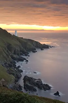 Spectacular sunrise behind Start Point Lighthouse in South Hams, Devon, England. Autumn
