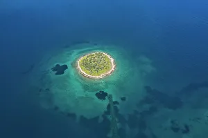 The st. Athanasios island in a blue sea, Greece