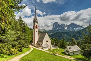St. Jakob church with Langkofel - Sassolungo mountain group in the background, Ortisei