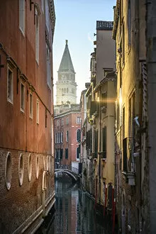 St Mark bell tower during sunrise as seen from Ponte dell Ovo. Venice, Veneto, Italy
