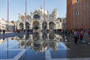 Images Dated 24th May 2018: The St Marks Basilica reflected in high tide water (Acqua alta), Venice, Veneto
