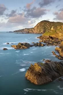 Images Dated 24th May 2011: St Nicholas Chapel and Beacon Point on the rocky coast of Ilfracombe, Devon, England
