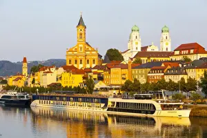 St. Pauls church & St. Stephans Cathedral illuminated at sunset, Passau, Lower Bavaria