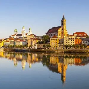 St. Pauls church & St. Stephans Cathedral illuminated at sunset, Passau, Lower Bavaria