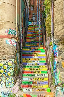 Staircase at Pasaje Galvez painted with colors and lyrics of song named Latinoamerica by Puerto Rican band Calle 13