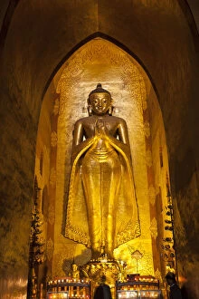 Standing Buddha gilded statue, Ananda Pahto temple, Bagan, Myanmar (Burma)
