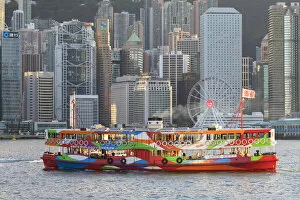 Star Ferry in Victoria Harbour with skyscrapers of Central, Hong Kong